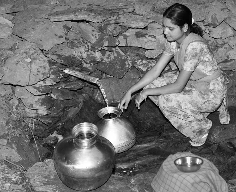 A 'gadera' (mountain spring) being used as a drinking water source near Devaprayag in district Tehri-Garhwal, Uttarakhand